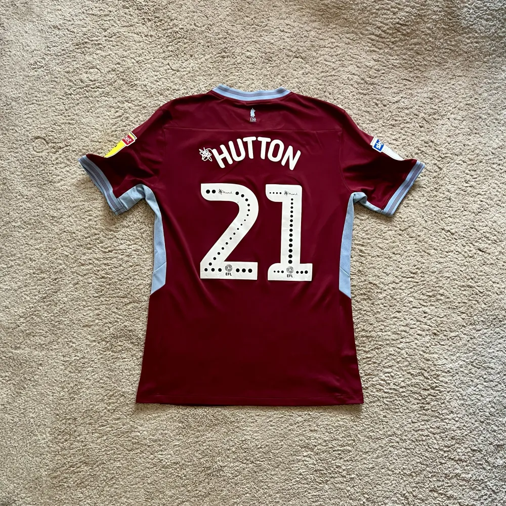 Rear view of Aston Villa 2018/19 Luke 1977 Home Shirt (32Red) - Men's Medium