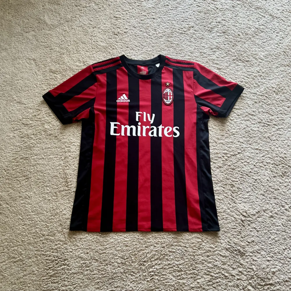 Front view of AC Milan 2017/18 Adidas Home Shirt (Fly Emirates) - Men's Medium